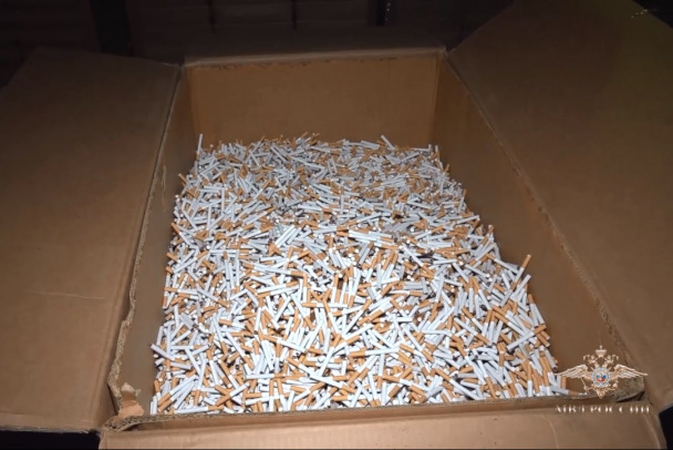 В Буграх нашли подпольное производство и склады, набитые миллионами пачек сигарет - видео